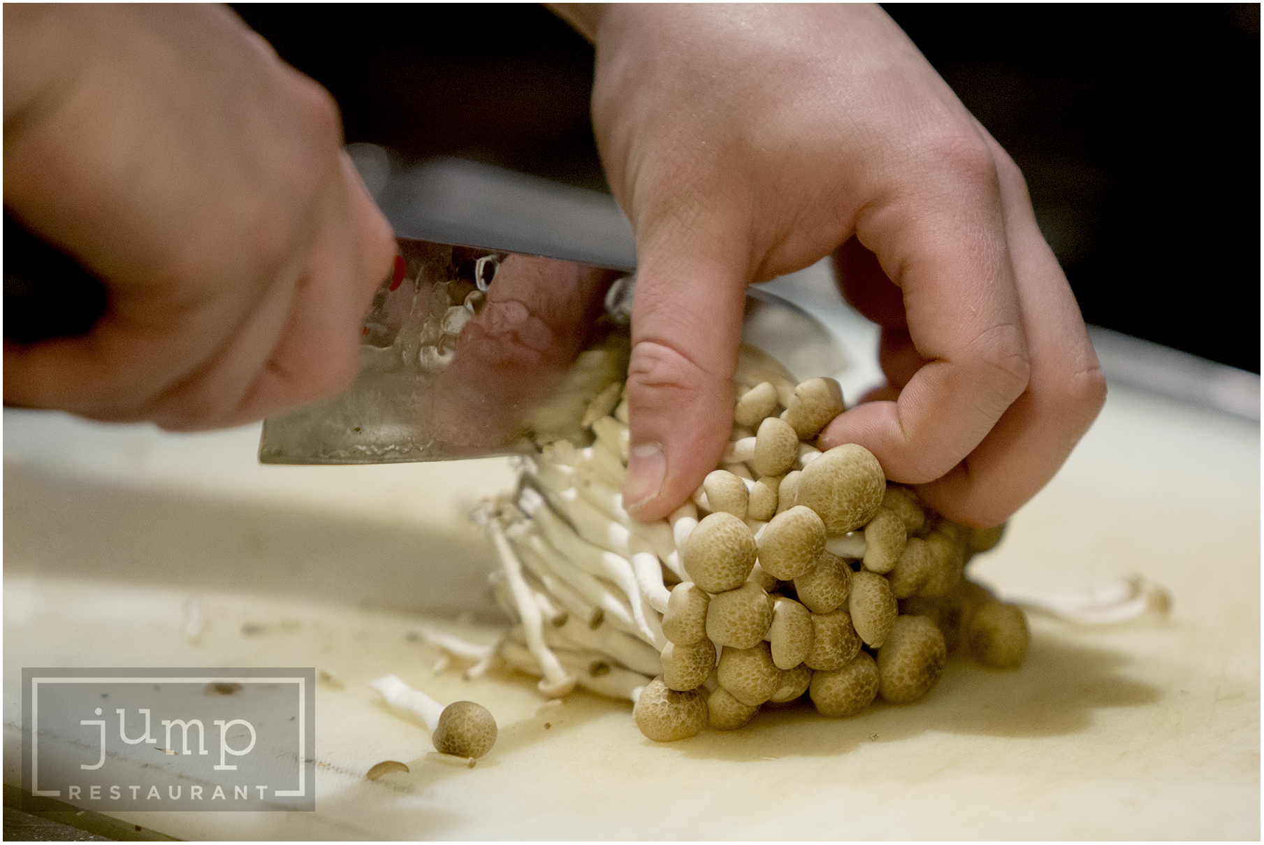 mushrooms being cut by a knife