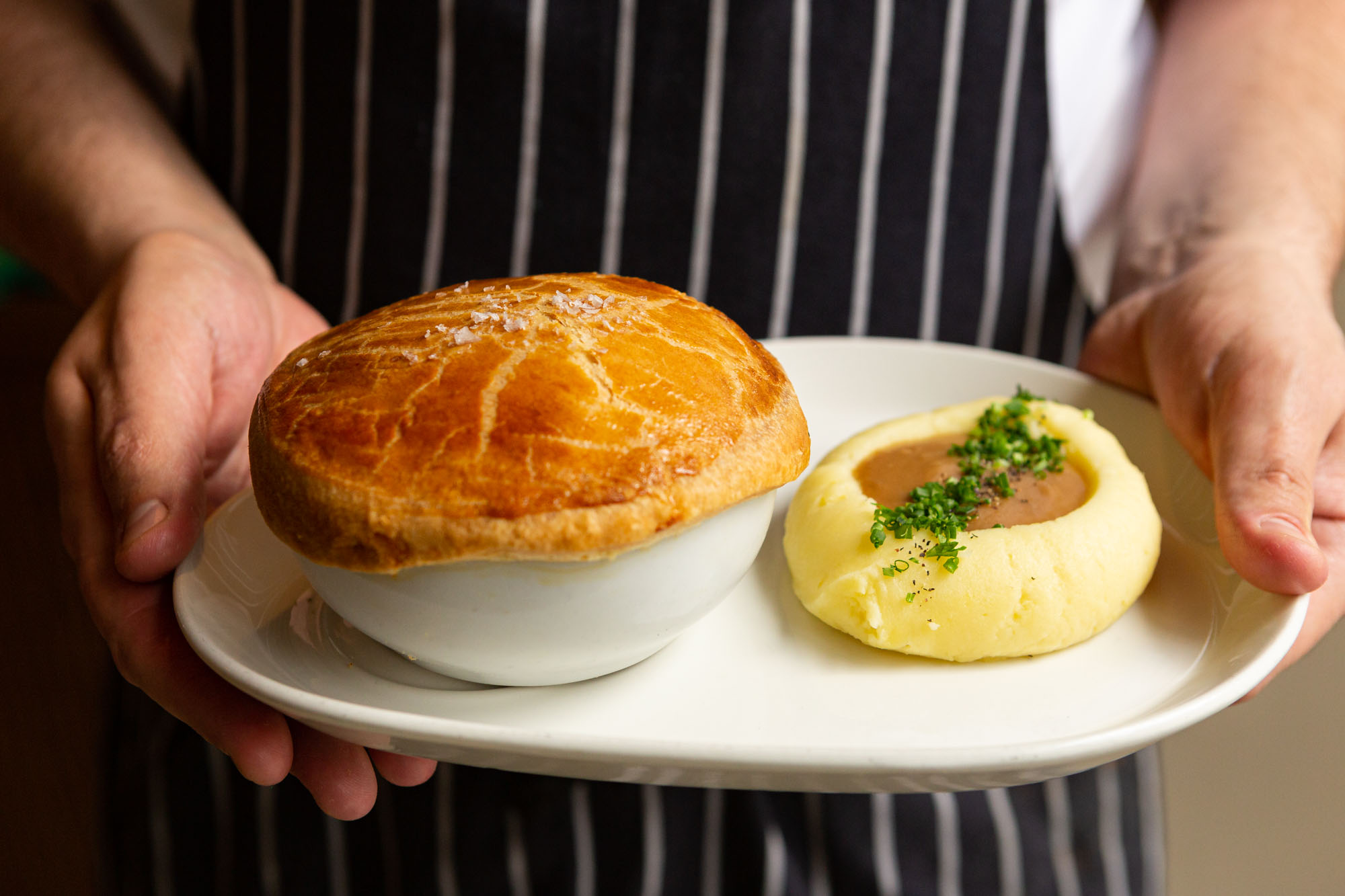 Arcadian chicken pot pie served with mashed potatoes and scratch gravy