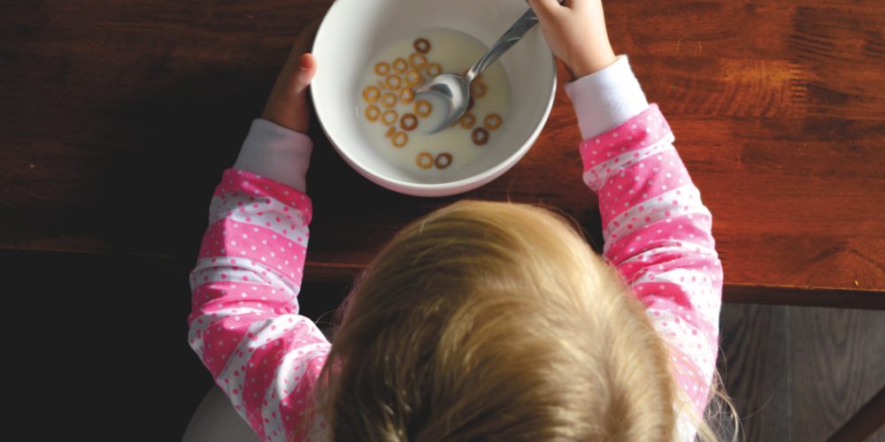 Child eating cereal in honour of Canoe childhood nostalgia tasting menu