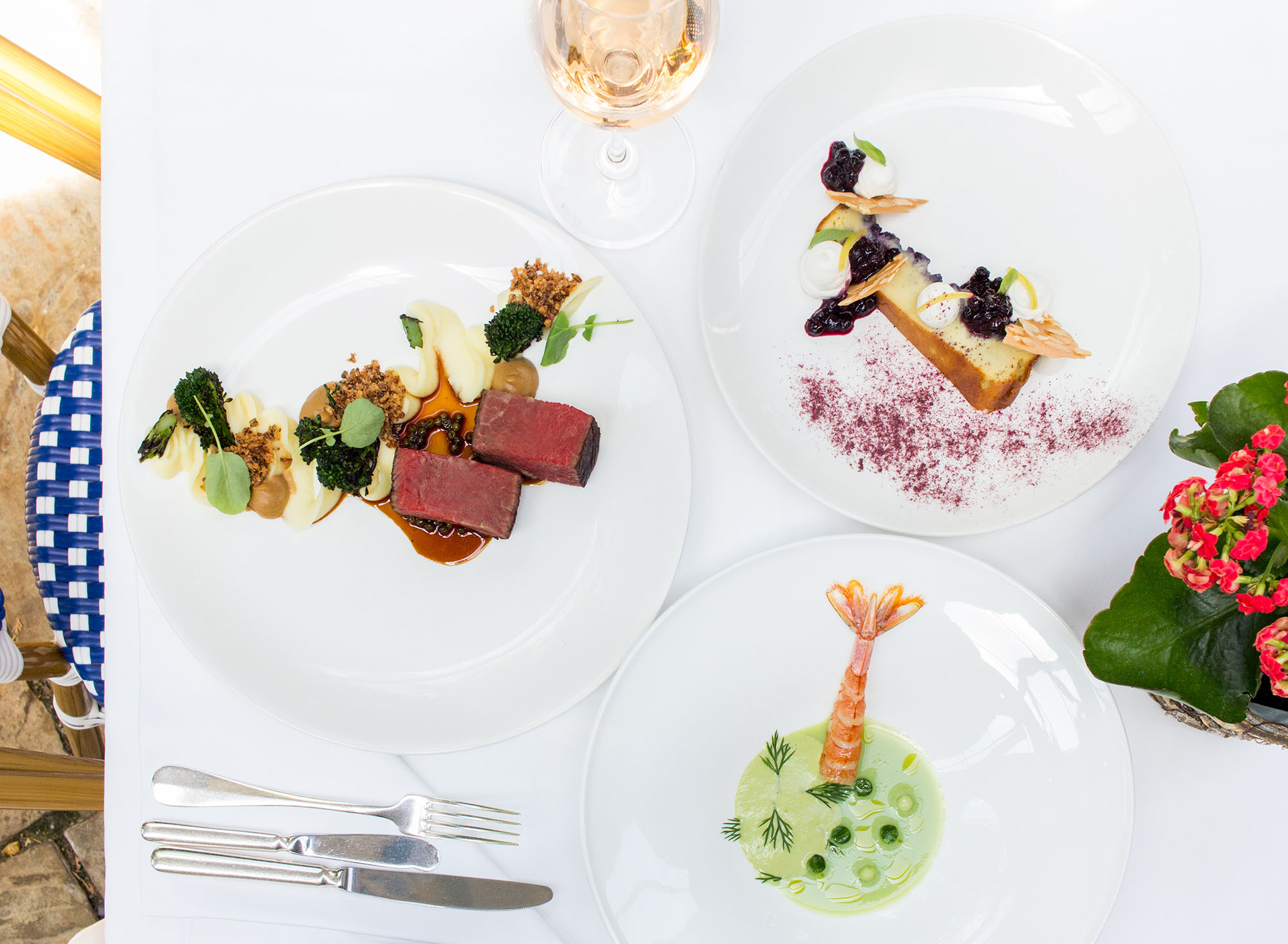 Summerlicious dishes on white table at Auberge du Pommier restaurant in North York
