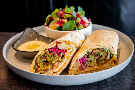 Smashed Falafel Wrap on a wood table