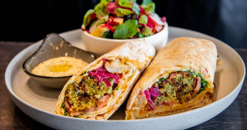 Smashed Falafel Wrap on a wood table