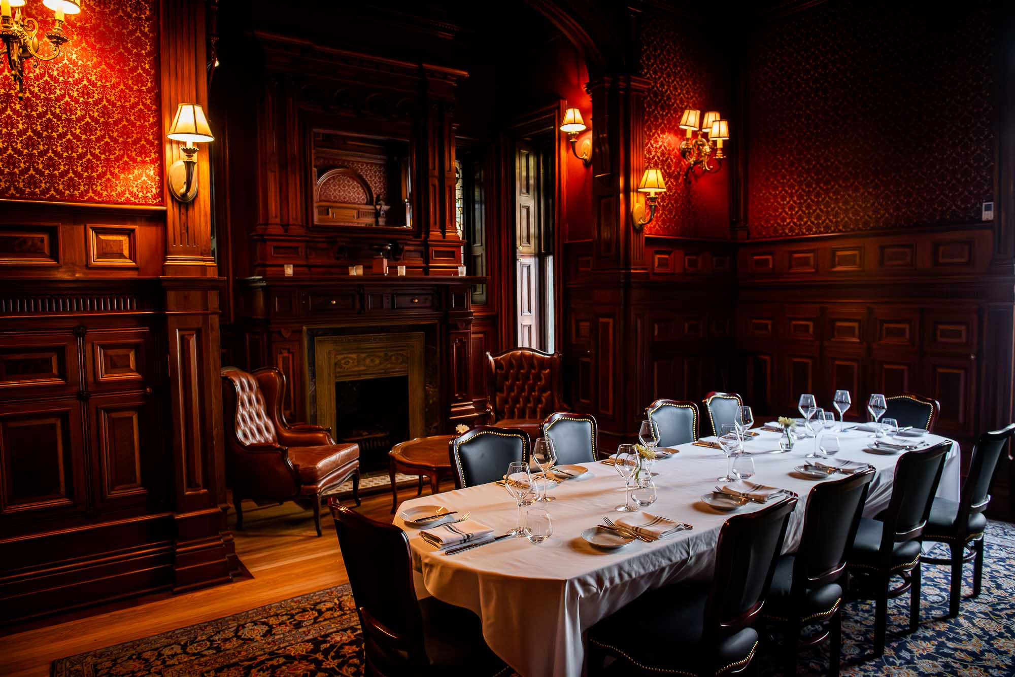a dining room with a table and chairs and a fire place