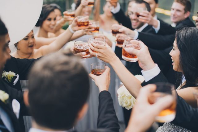 Wedding guests toasting with drinks