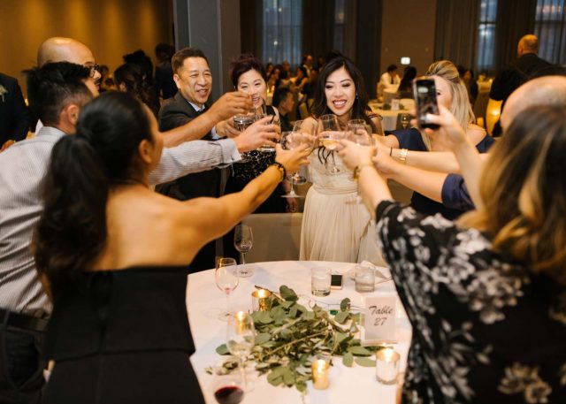 Wedding guests cheersing at Hudson event venue in Calgary