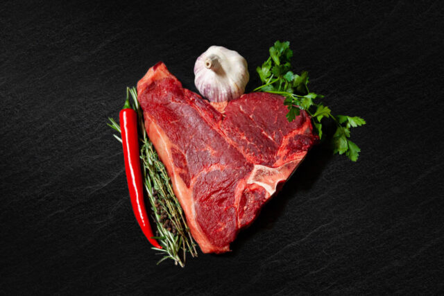 Porterhouse steak from Cleaver Meat Co. on a black backdrop