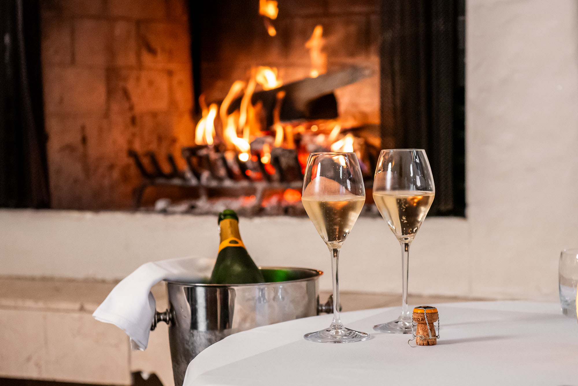 auberge du pommier fireplace champagne glasses