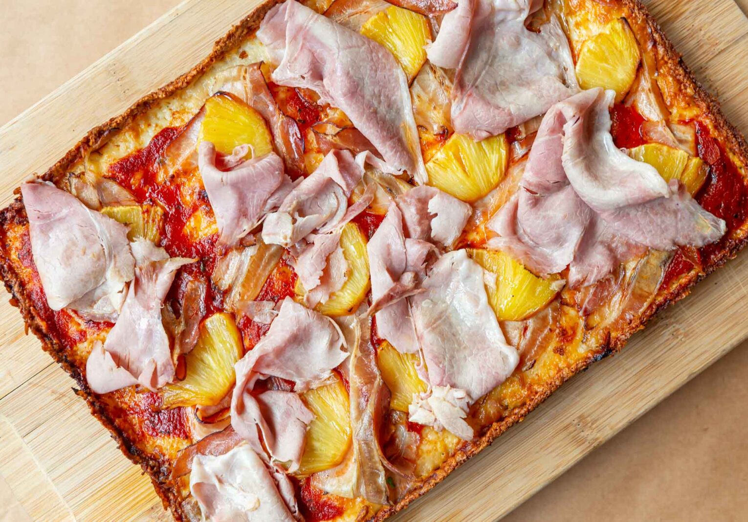 Detroit-style pizza topped with ham and pineapple at Beauty Eats in Toronto
