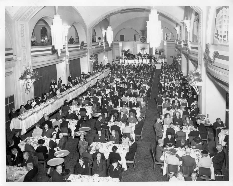 vintage 1944 photo of employees gathered for Liberace performance at arcadian court