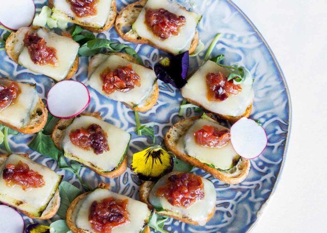 a serving plate of goat cheese and biscuits