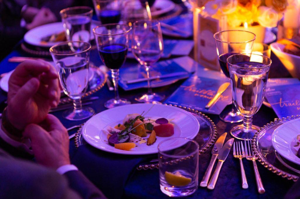 Plated dinner on a set table at Arcadian Court in Toronto