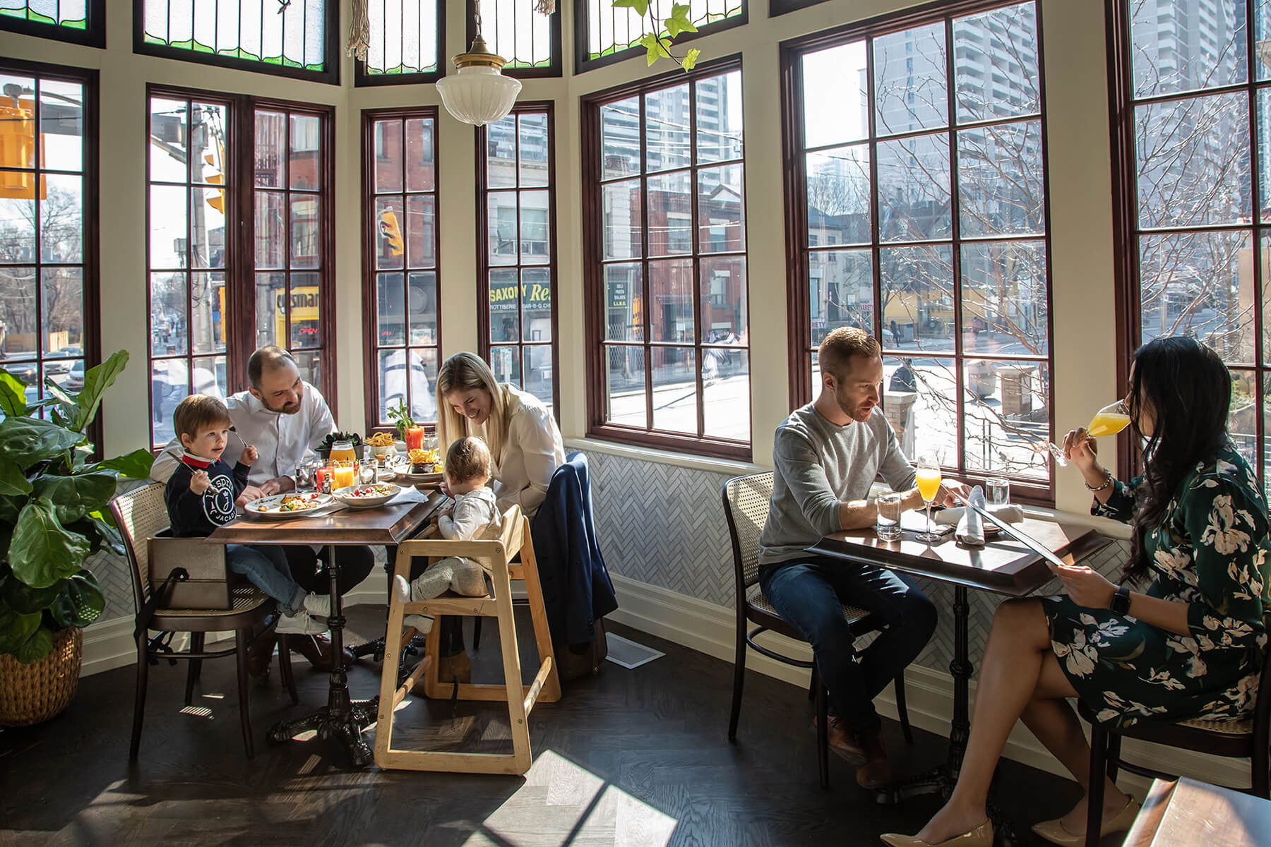 A family and a couple enjoying brunch at Maison Selby