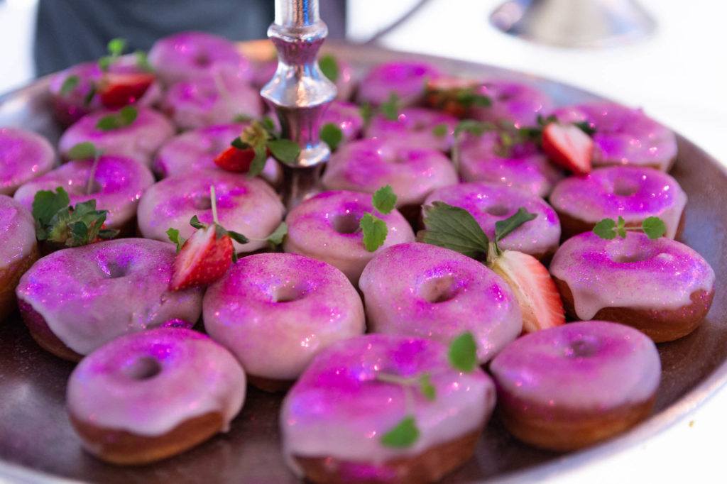 Tray of purple donuts at The Carlu in Toronto