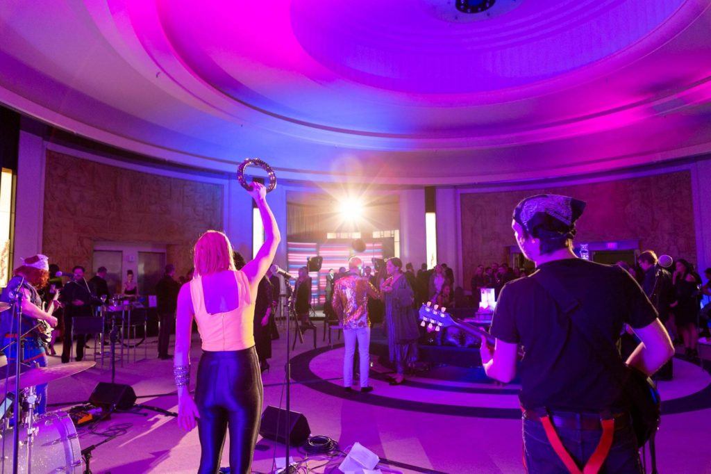 Live rock band performing in the Round Room at The Carlu