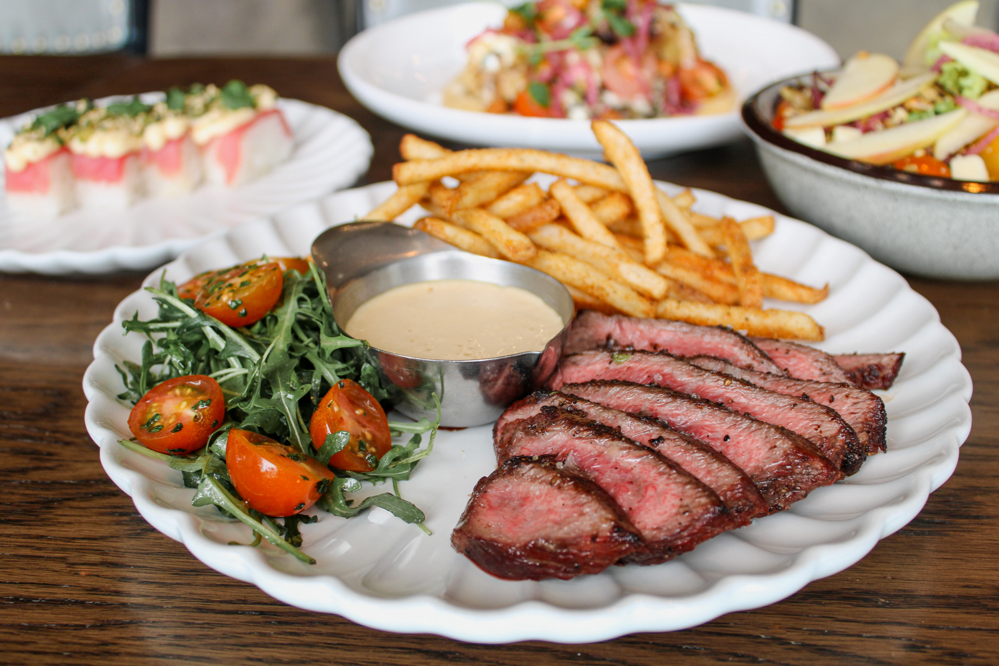 Steak frites on a wood table