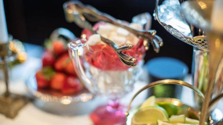 Antique tongs, sugar cubes and citrus on the Alchemy bar top.