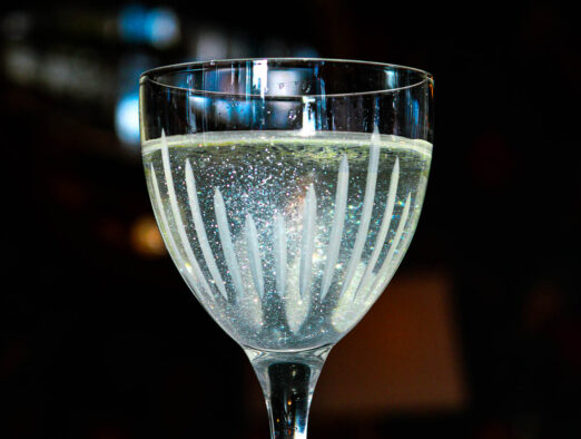 alchemy halloween cocktail with clear sparkling liquid