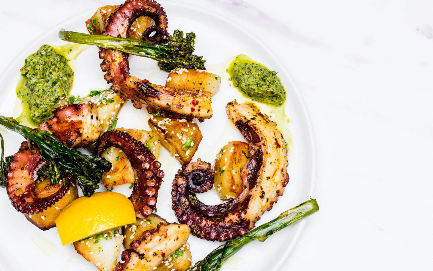 grilled octopus, sesame garlic potatoes, green harissa, spinach