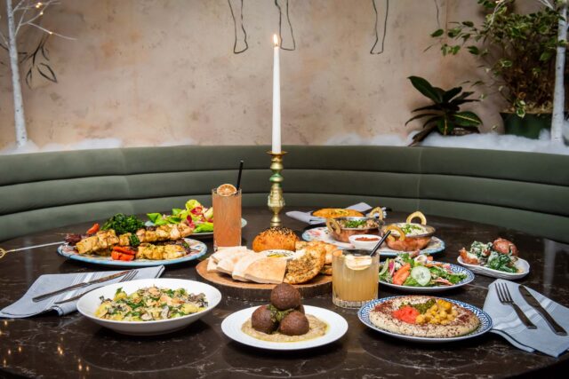 full table set with sunday feast kebabs, falafel, naan